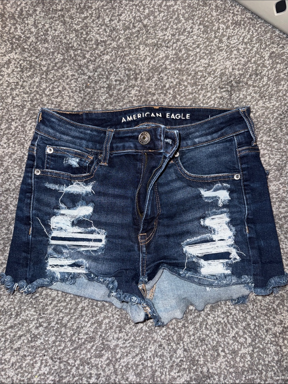 American Eagle Outfitters dark blue distressed denim shorts